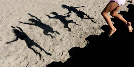 Kiwi kids like to hit the beach, which is all part of their wellbeing. Photo / Alan Gibson