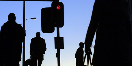 Inner city workers race the red light during the 5pm rush in Auckland. Photo / David White