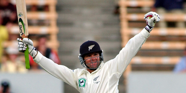 Nathan Astle celebrates bringing up his quickfire double ton against England. Photo / Getty Images
