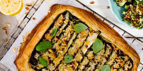 Courgette, parmesan and garlic tart with green olive dressing. Photo / NZH