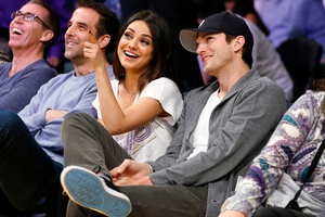 Mila Kunis and Ashton Kutcher can't wait to live together. Photo / AP