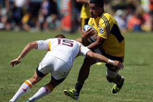 Rey LeeLo of the Hurricanes is tackled by Gareth Anscombe of the Chiefs during the Super Rugby trial match between the Hurricanes and the Chiefs. Photo / Getty Images.