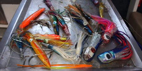 A colourful collection of fishing lures is standing by for action. Photo / Paul Rush
