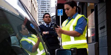Parking warden Kelly on patrol with security supervisor Karamjeet Singh. Photo / Steven McNicholl
