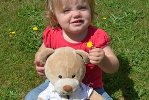 18-month-old Hayley Ryan with Nait, the travelling teddy bear who is currently staying with Hayley and her family in Stratford. Photo / Supplied
