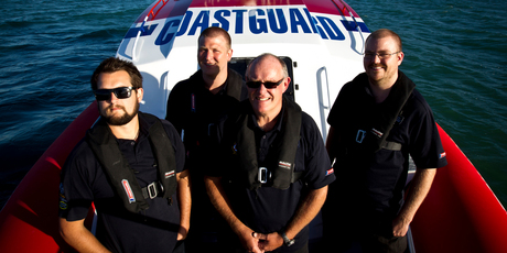 Coastguard crew members Elliot Brown, James Turner, Graeme Ogg and Stephen Maisey at work on board one of the Auckland Coastguard boats. Photo / NZH