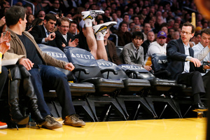 Los Angeles Lakers' Steve Blake falls over empty courtside chairs as he tries to save a ball from going out of bounds against the Phoenix Suns. Photo / AP