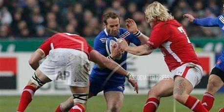 Frederic Michalak (centre) and his French team-mates wilted against the Six Nations challenge of Italy and Wales. Photo / AP