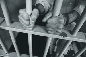 A West Coast drug dealer allegedly attempted to bribe his prison guard with $2000 for tips. Photo / File