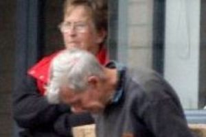 Bev and Trevor Oliver at the front door of their Willowpark Drive home. Photo / Wairarapa Times-Age