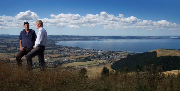 Federated Farmers provincial president Neil Heather and MP Todd McClay, on the heights of Mr Heather's farm overlooking Lake Rotorua, are happy progress has been made. Photo / Alan Gibson.