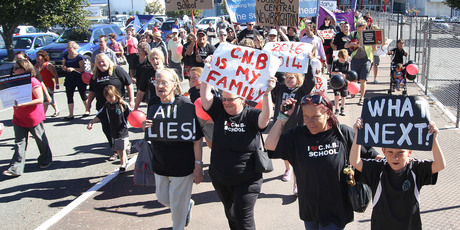 Teachers and students of Central New Brighton School protest school closures and merges at CBS Canterbury Arena. Photo / APN