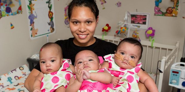 Niah Evile Pule with her 6-month-old triplets Agaalofa, Agamalu and Agalelei. Photo/ Martin Hunter