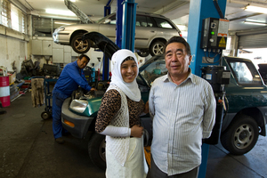 Laila Basiri with her grandfather Qurban Ali and father Shahwali at the family auto mechanic business. Photo / Michael Craig