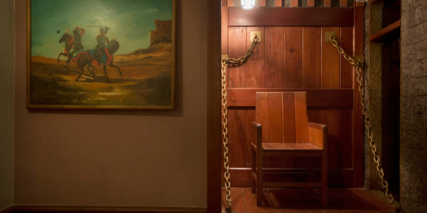 An iron chain-strewn chair decorates the Medieval Room at the Shalimar Hotel. Photo / AFP
