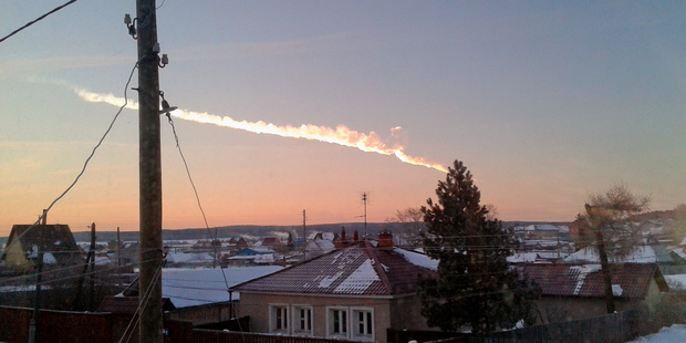 The meteorite contrail is seen over a vilage of Bolshoe Sidelnikovo 50 km of Chelyabinsk. Photo / AP