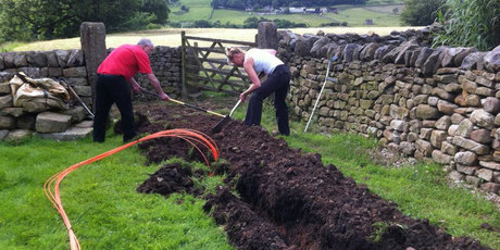 Lancashire locals digging trenches for high speed broadband as part of the b4rn project. Photo / supplied
