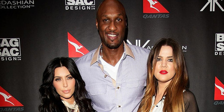 Khloe Kardashian, right, with her husband Lamar Odom and sister Kim. Photo/AP