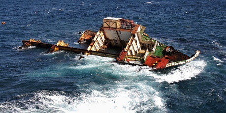 What is left of the stricken ship Rena on the Astrolabe Reef off the coast of Tauranga. Photo / Bay of Plenty Times