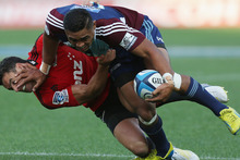 Francis Saili of the Blues fends off Daniel Carter of the Crusaders. Photo / Getty Images.