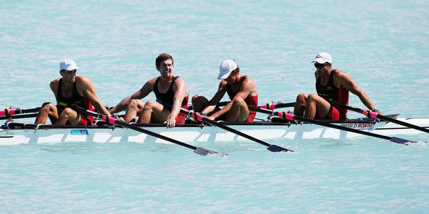 Nathan Cohen, Nathan Flannery, Fergus Fauvel and Hayden Cohen celebrate their victory in the quadruple sculls. Photo / Getty Images