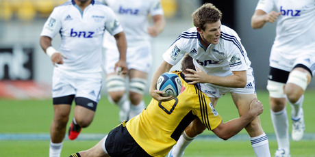 Chris Noakes encounters Beauden Barrett during the Blues' opening Super match, against the Hurricanes on Saturday. Photo / Getty Images