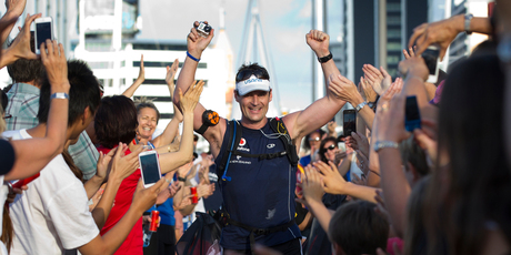 Mike Allsop finishes his final marathon at Wynyard Quarter in Auckland, yesterday. Photo / Brett Phibbs