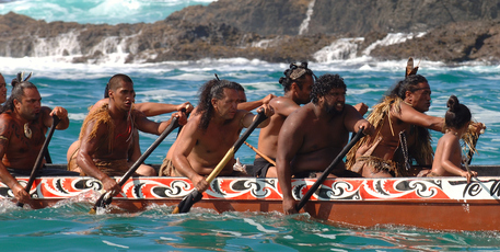 Waka paddlers on the way to meet wealthy overseas visitors, customers of Ahipara Luxury Travel. Photo / Supplied