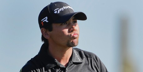 Jason Day watches his tee shot off the 11th hole in the quarter-final against Graeme McDowell. Photo / AP