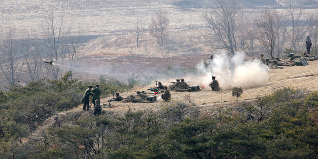 A Korean People's Army artillery unit participate in a live fire drill while North Korean leader Kim Jong Un, unseen, inspects the unit at an undisclosed location, in North Korea. Photo / AP