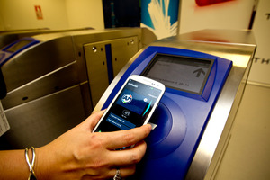 Demonstrating the new mobile wallet on replica gates at Thales test lab in Auckland. Photo / NZH