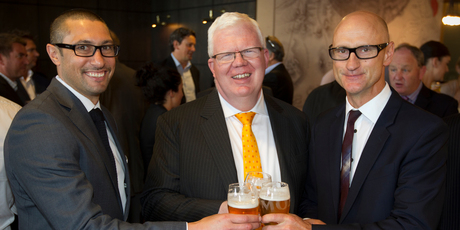 Moa's marketing manager Sunil Unka (left) and chief executive Geoff Ross (right) enjoy a beer with NZX boss Tim Bennett after the company listed on the NZX in November. Photo / Greg Bowker