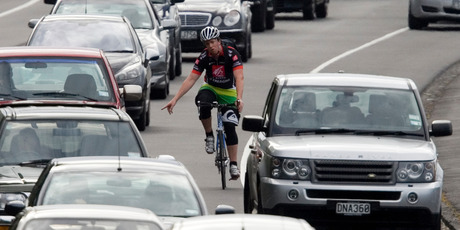 A cyclist shares the road with drivers on Auckland's Tamaki Drive. Photo / Dean Purcell