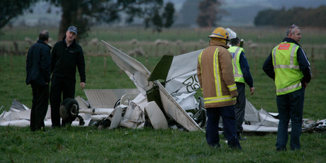 Investigators look over the wreckage of a Cessna 152 in which Jessica Neeson and Patricia Smallman died after a mid-air collision in July 2010. Photo / Kevin Bills