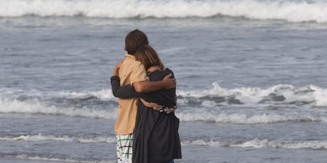 Meg Strange, wife of Adam Strange, is comforted by friend Simon Shephard. Photo / Brett Phibbs