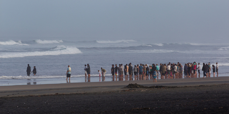 Friends and family of Adam Strange at a healing ceremony on Thursday at Muriwai. Photo / Brett Phibbs