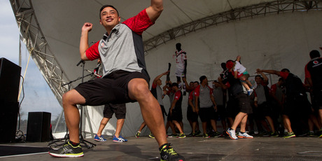 Kevin Locke leads the Warriors this week in a Harlem Shake at the community launch of their 2013 National Rugby League season. Photo / Richard Robinson