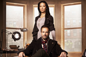 Jonny Lee Miller is a tattooed Holmes, with a female Watson (Lucy Liu). Photo / Supplied