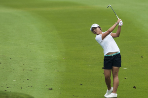 Lydia Ko eyes the green at the Thailand Open. Photo / Getty Images