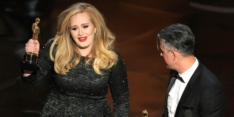 Adele accepts her Oscar for Best Original Song. Photo/AP