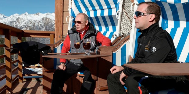 Russian Prime Minister Dmitry Medvedev, right, and President Vladimir Putin drink tea in a skiing and biathlon complex "Laura" at the mountain resort of Krasnaya Polyana. Photo / AP
