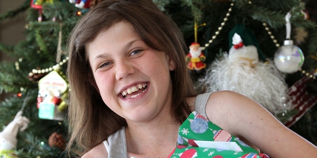 HOME IS HAPPINESS: Three years after a major transplant, Matisse Reid celebrated her first Christmas and 13th birthday at home with family. PHOTO/DUNCAN BROWN HBT134593-01