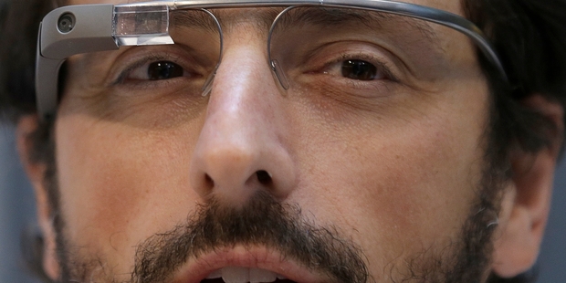 Google co-founder Sergey Brin wears Google Glass glasses.