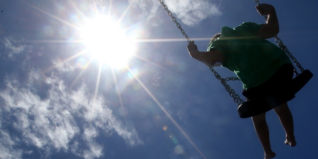 HAVING FUN: But falling from playground equipment such as swings can cause injury.