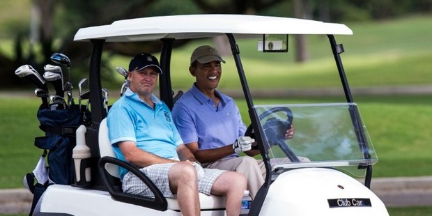Barack Obama and New Zealand Prime Minister John Key drive up to the green of the second hole at the Kaneohe Klipper Golf Course. Photo / AFP