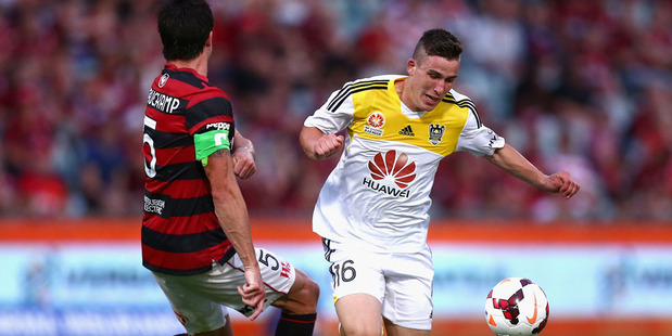 Michael Beauchamp of the Wanderers tackles Louis Fenton of the Phoenix during the round 13 A-League match against the Western Sydney Wanderers. Photo / Getty Images