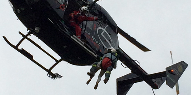 The trapped victims had to be winched to safety. Photo / Greenlea rescue helicopter