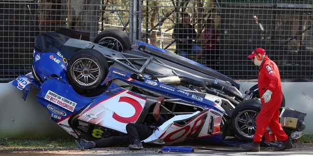 Track marshals race to the aid of veteran Jason Bright who smashed into the wall. Photo / Getty Images