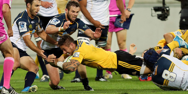 TJ Perenara scores for the Hurricanes against the Brumbies. Photo / Getty Images