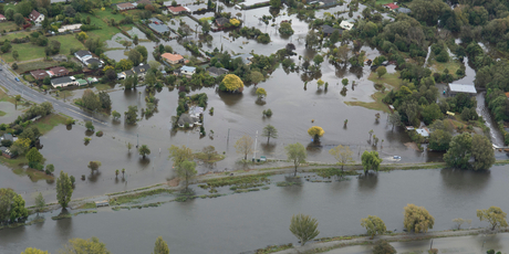 Flooding from the Avon River in the red zoned section of Dallington in Christchurch. Photo / SNPA / David Alexander